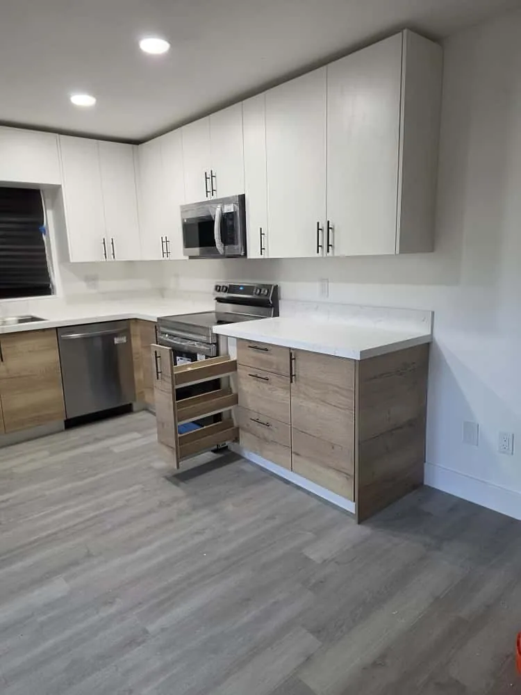 Light oak kitchen with pull-out drawers open
